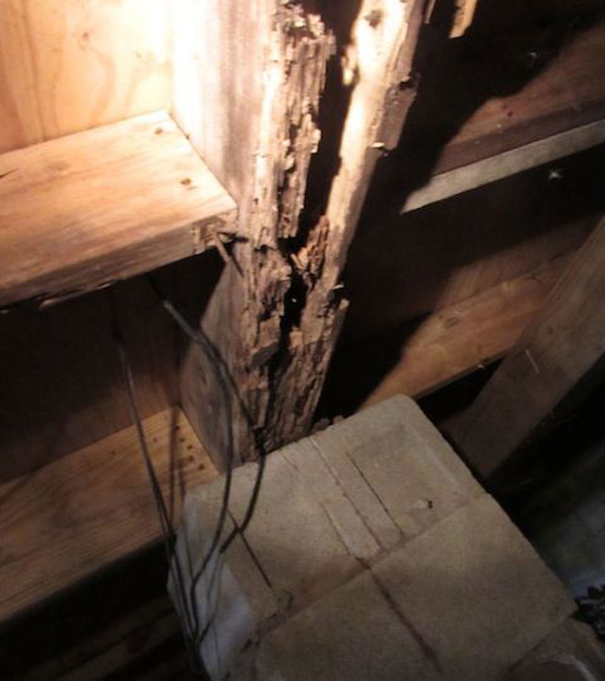 wall without drywall, destroyed beams exposed